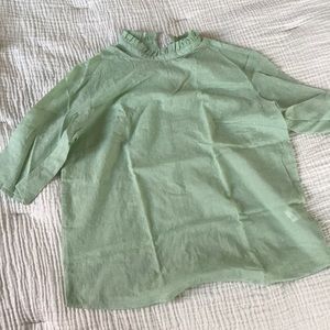 Green ruffle-collar blouse